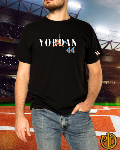 Person wearing a black t-shirt with 'Yordan 44' design on a sports field background